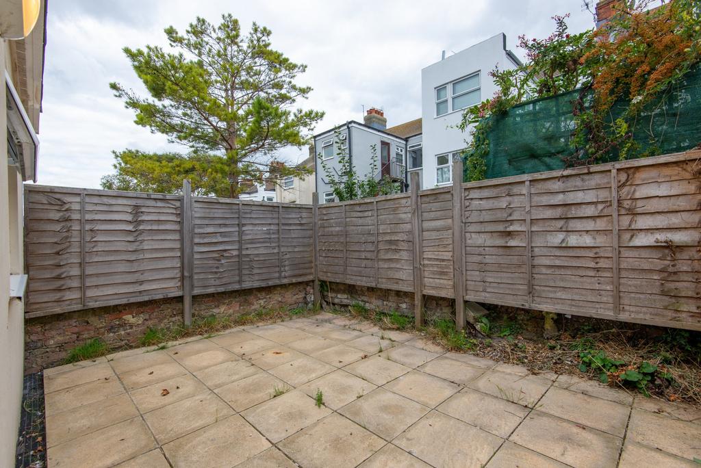 Private paved rear garden with low-maintenance ...