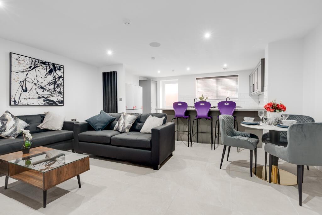 A bright and spacious contemporary living room ...