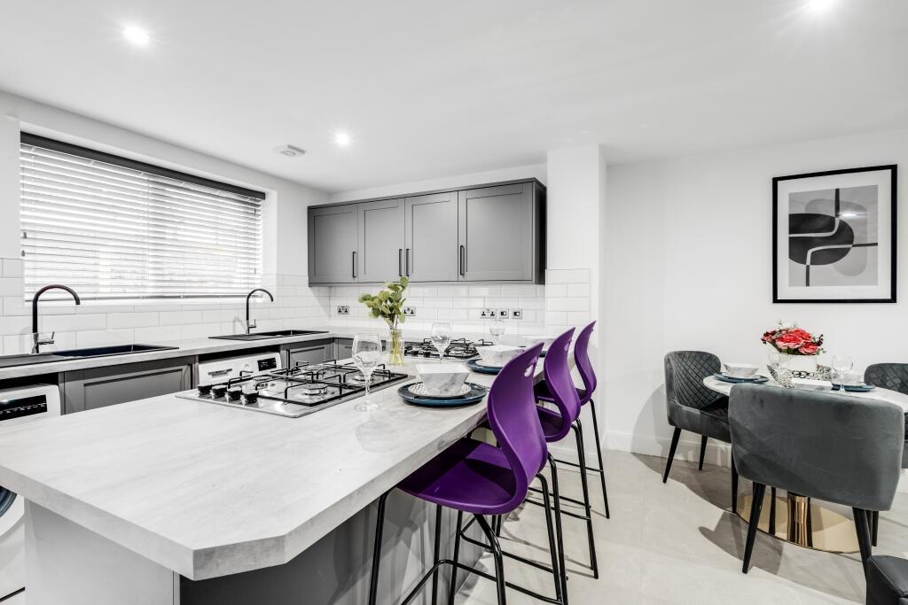 Spacious and modern kitchen with ample natural ...