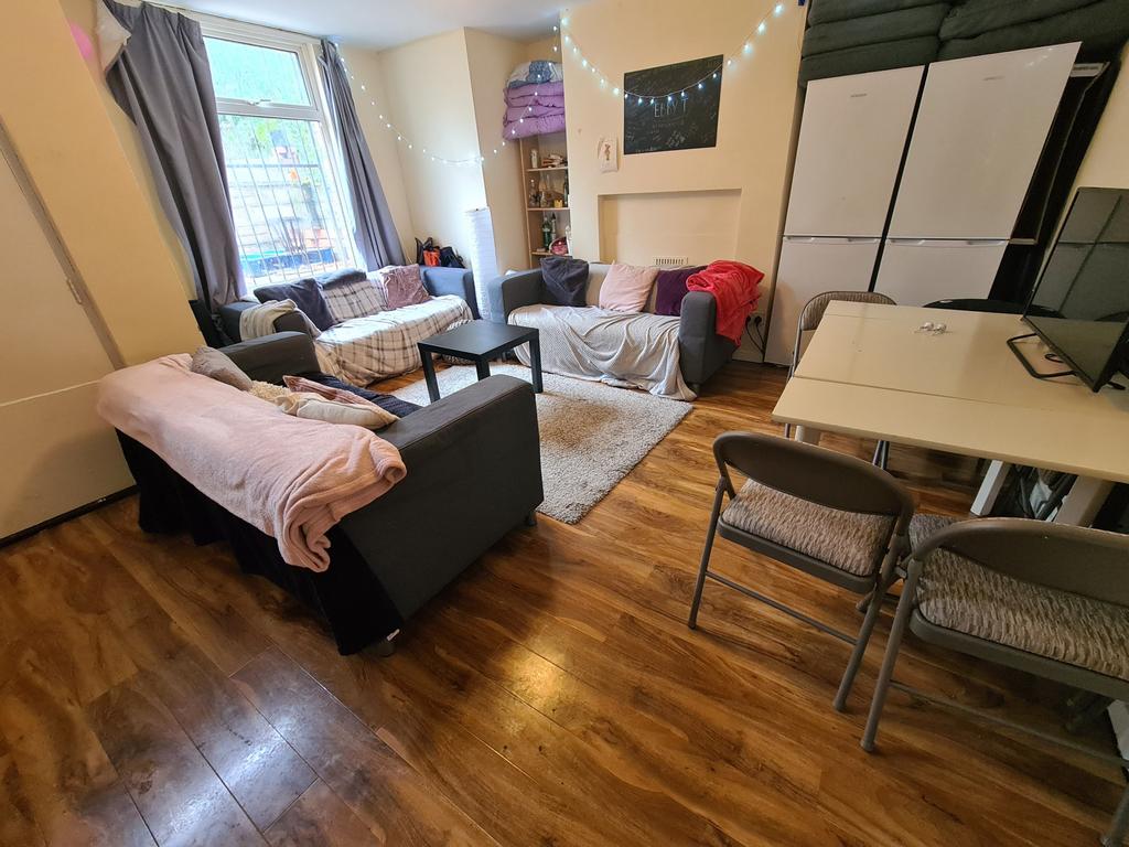 Bright and welcoming living room featuring comf...