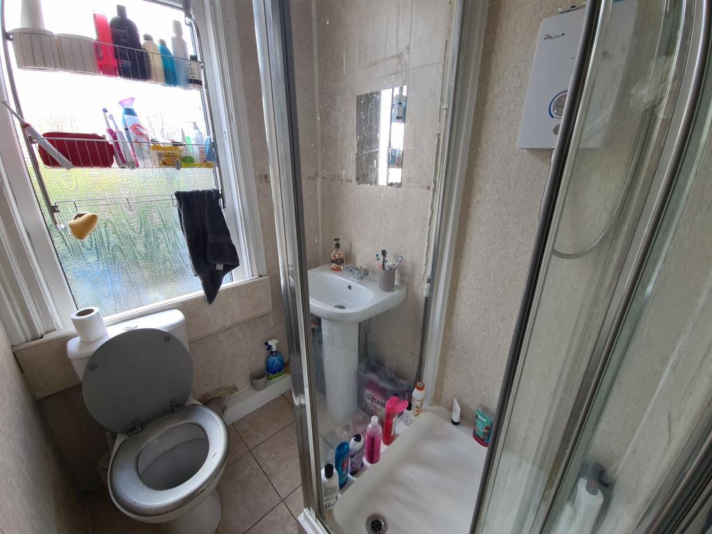 A clean and functional bathroom with a toilet, ...