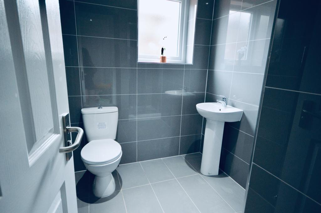 A clean, well-maintained bathroom featuring a t...