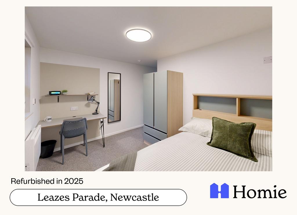 A bright and clean bedroom featuring a neatly m...