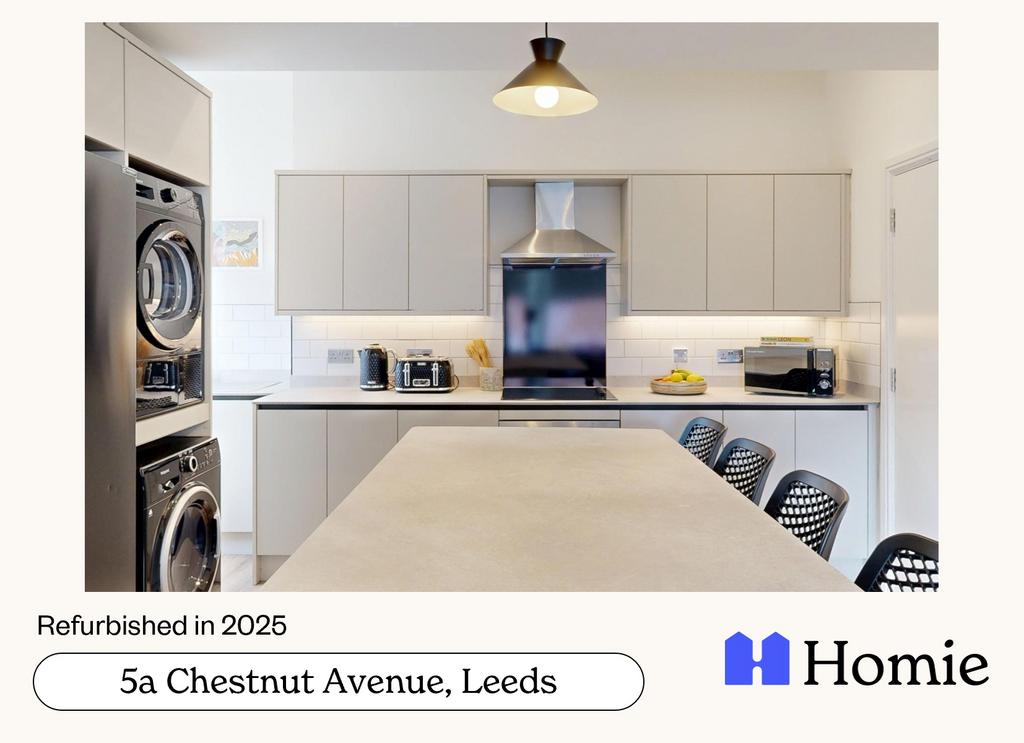 Modern, spacious kitchen with ample counter spa...