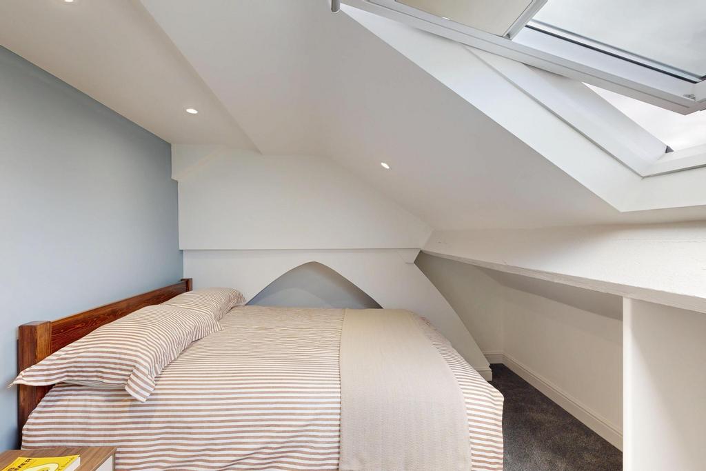 Bright and spacious master bedroom with ample n...