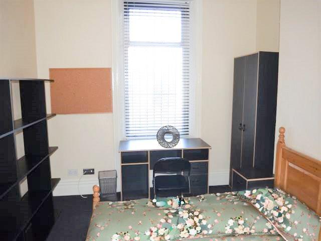 Bedroom with green b