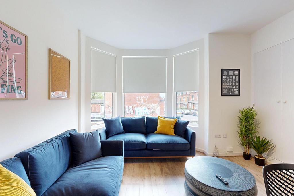 A bright and inviting living room featuring a m...