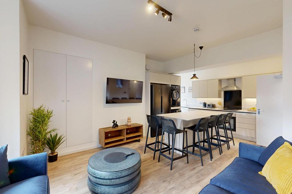 Modern and inviting living room featuring comfo...