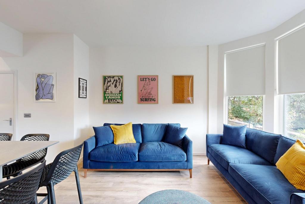 Bright and spacious living room featuring moder...