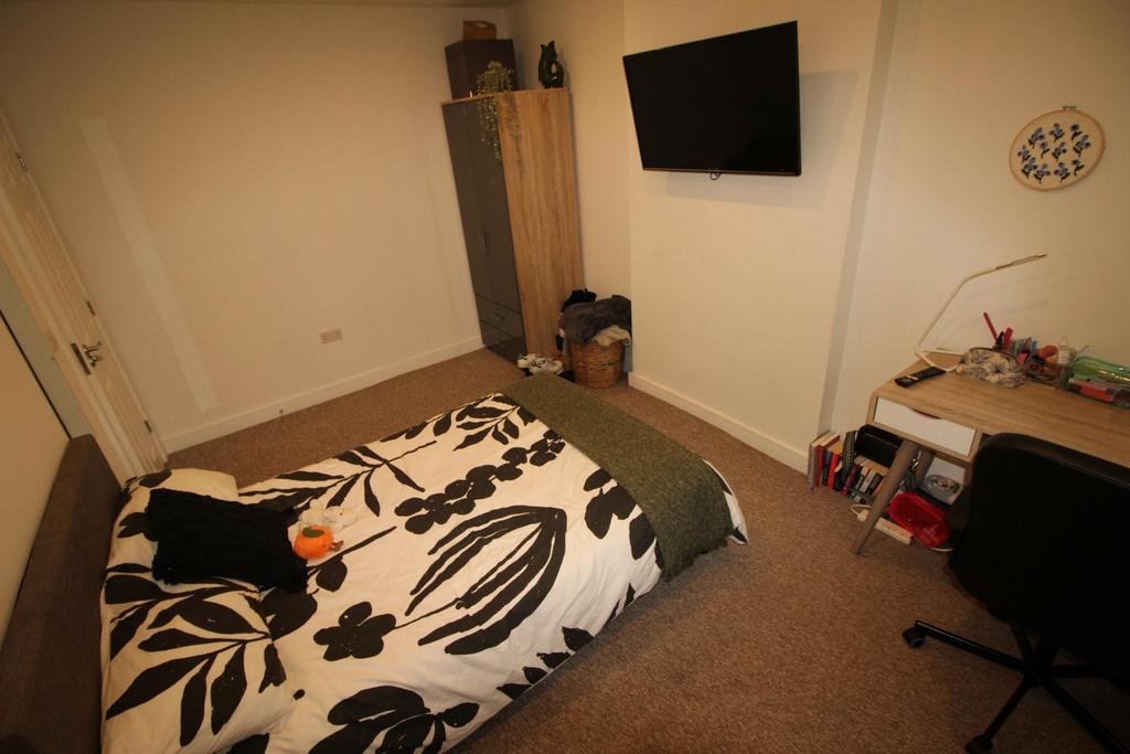 Well-presented furnished bedroom with a double ...