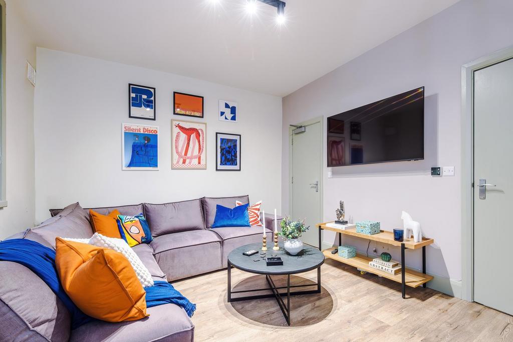 Bright, modern living room with a comfortable L...