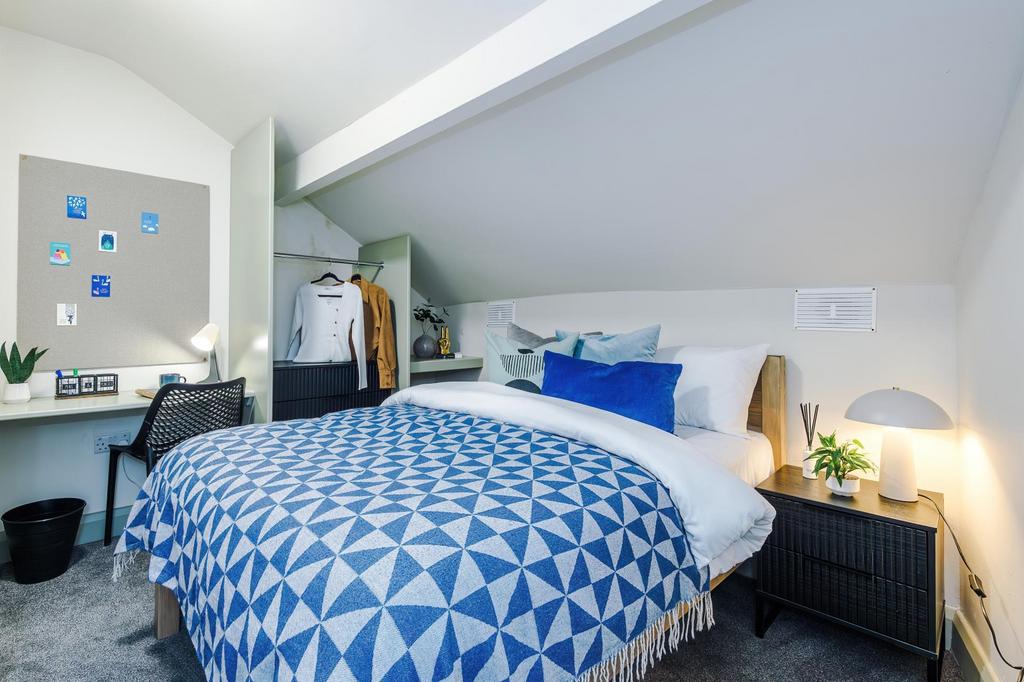 Bright, stylish attic double bedroom with pitch...