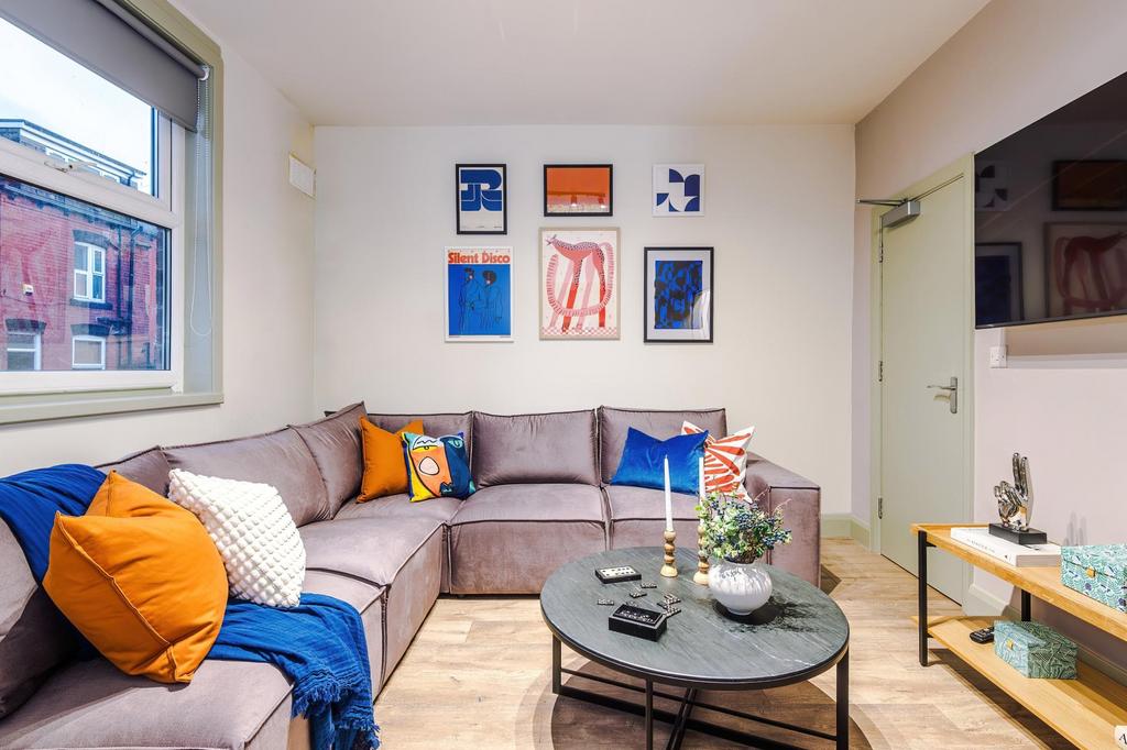 Bright, modern living room with a comfortable L...