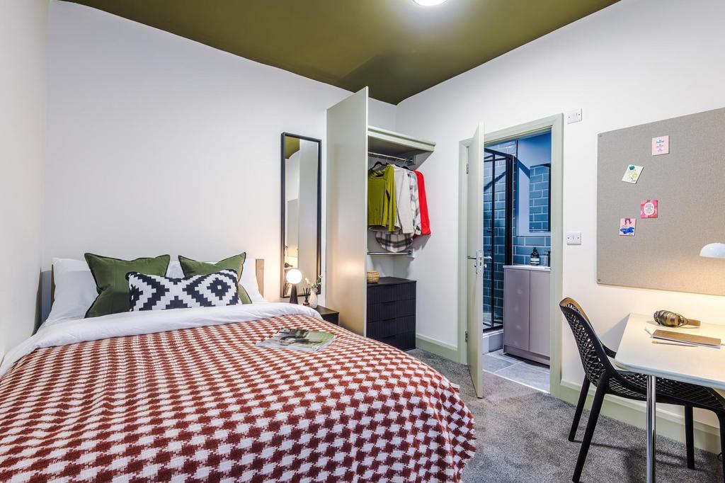 Bright, modern bedroom with a comfortable doubl...