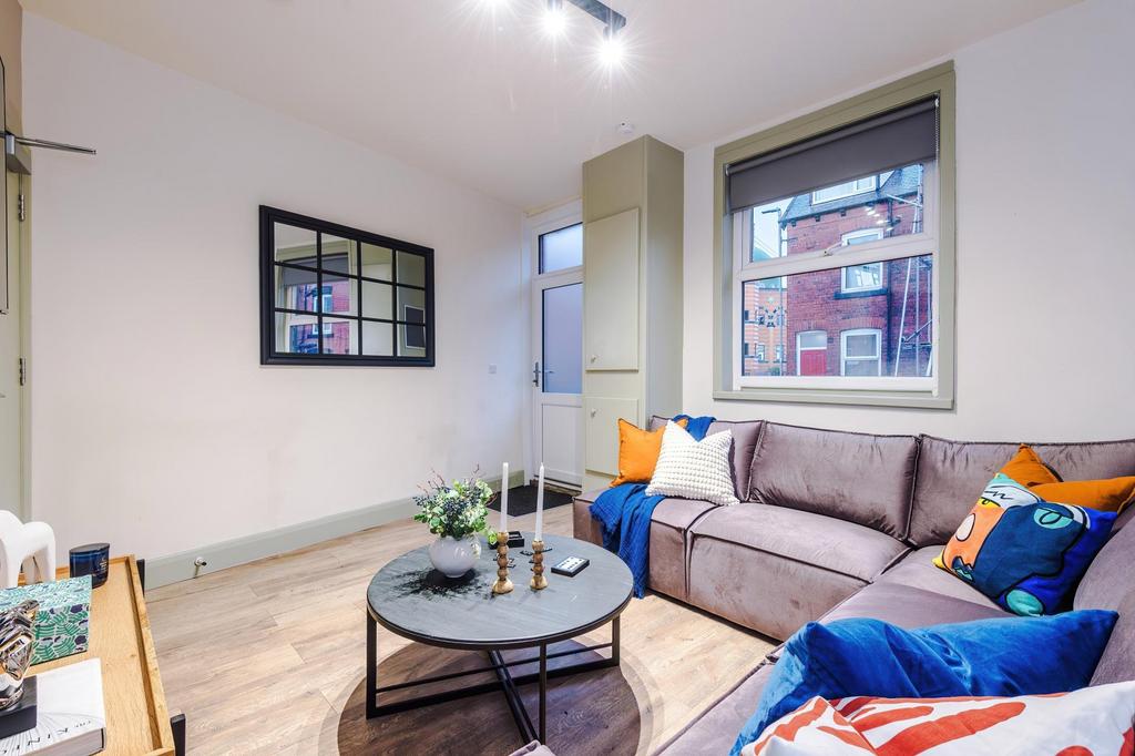 Bright, modern living room with a comfortable s...