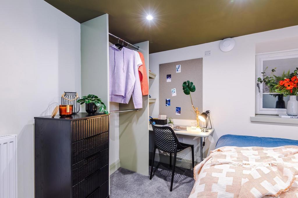 Freshly furnished single bedroom with a neatly ...