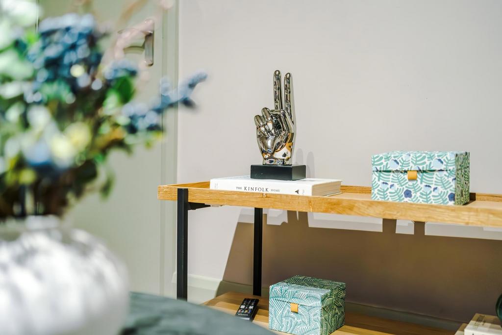 Stylish living area detail featuring a neat woo...