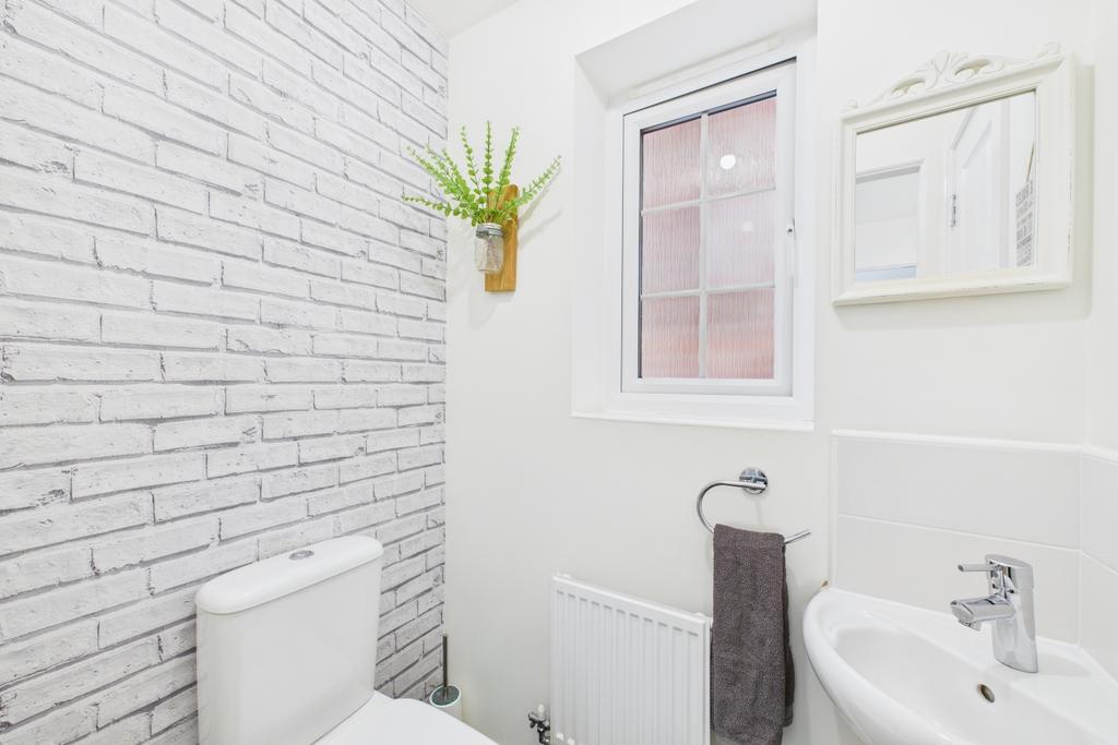 Practical and stylish this downstairs toilet also