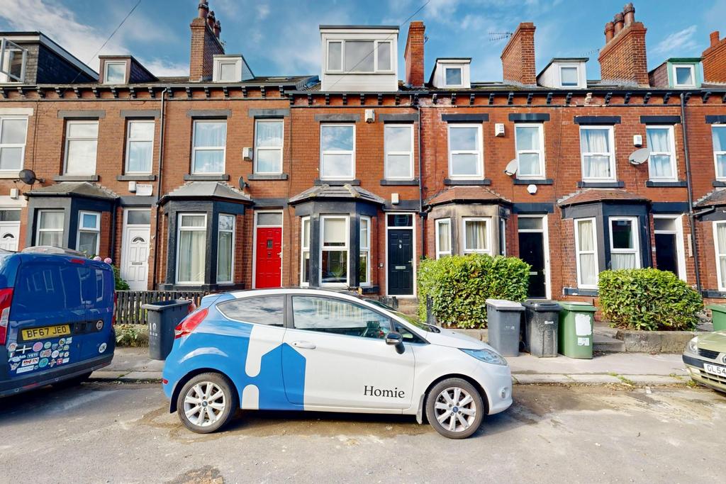 A charming front view of a traditional terraced...