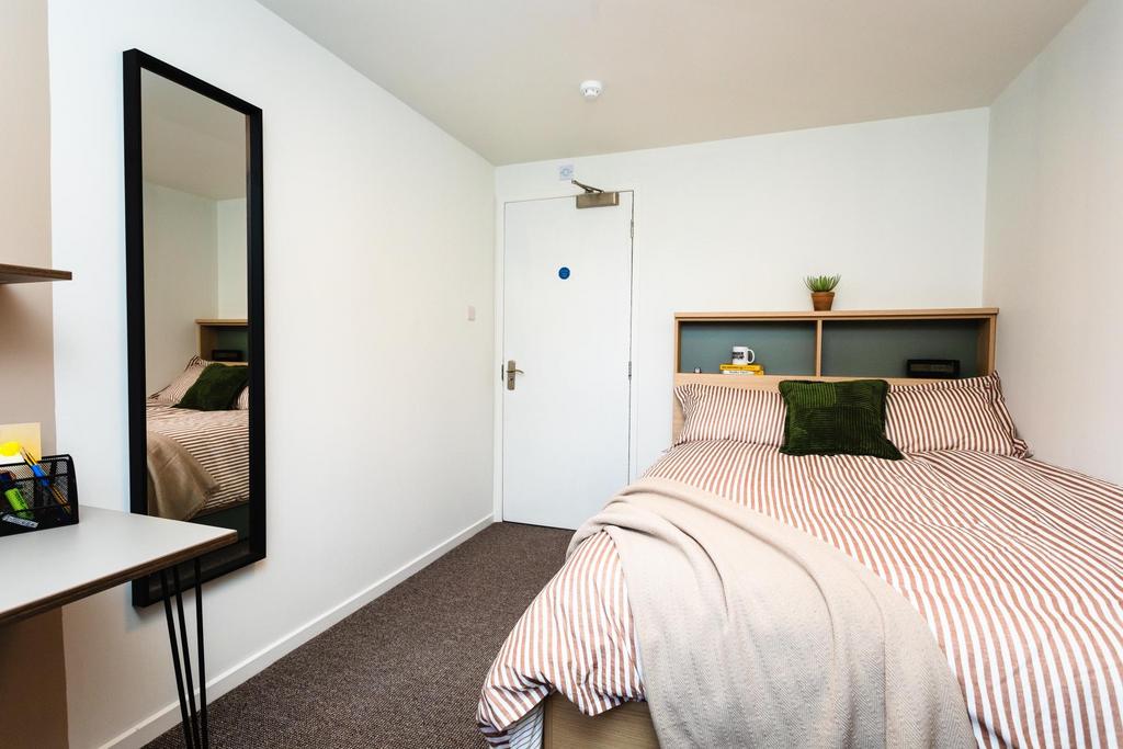 Bright, neatly presented bedroom with a double ...