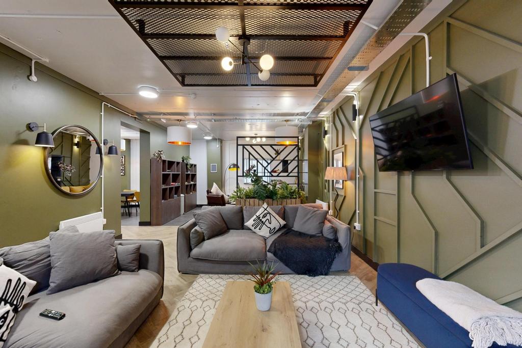 Contemporary communal lounge with comfortable s...