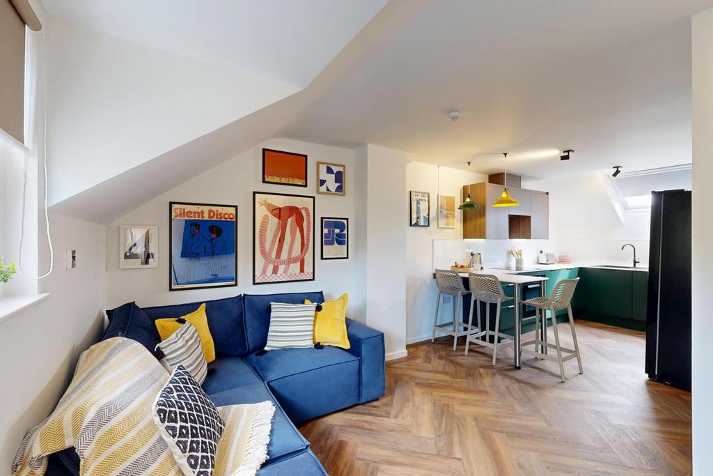 A bright and stylish living room featuring cont...