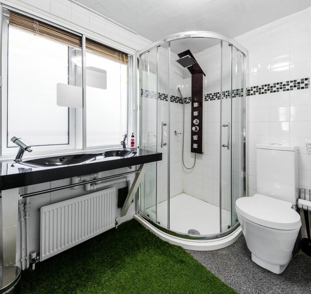 A modern and clean bathroom featuring a stylish...
