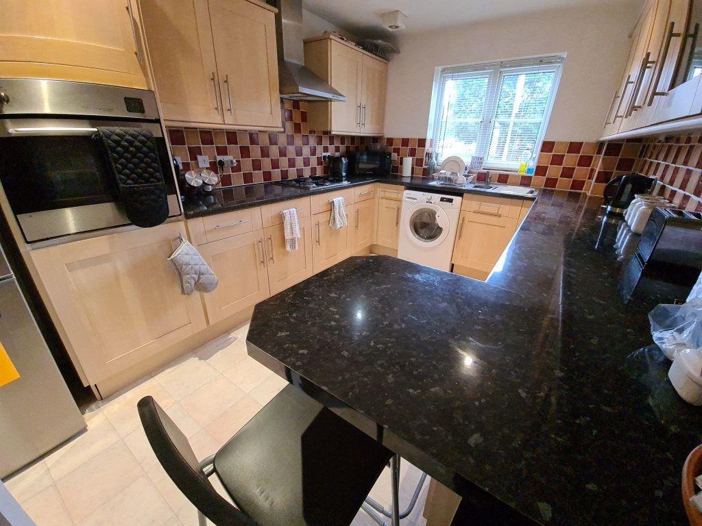 A bright and well-maintained kitchen featuring ...