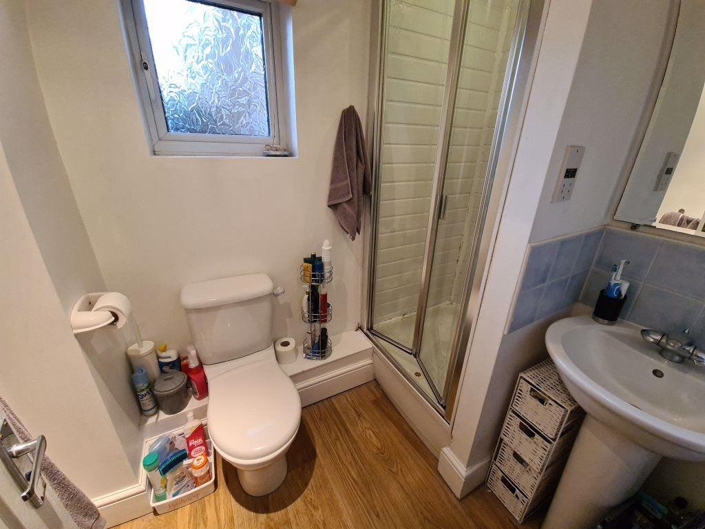 A tidy bathroom featuring a toilet and a spacio...