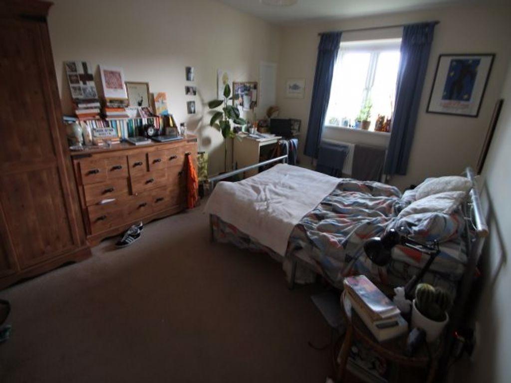 A spacious and inviting master bedroom featurin...
