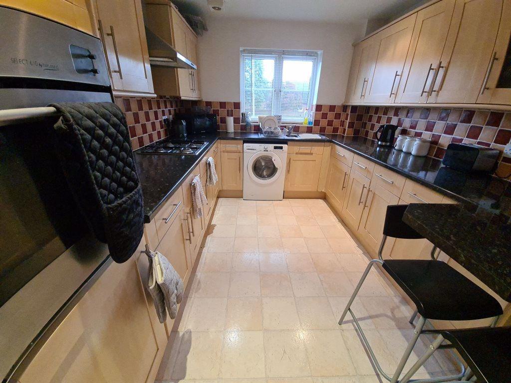 A well-maintained and brightly lit kitchen with...