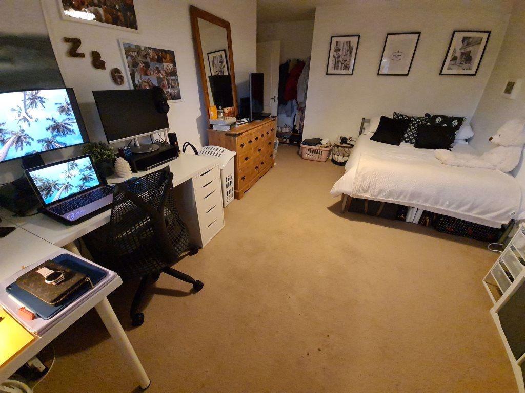 A spacious and well-maintained living room feat...