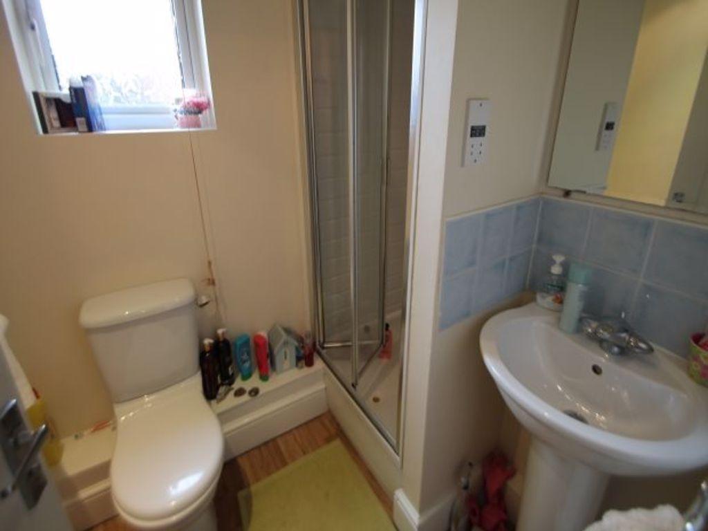 A clean and modern bathroom featuring a toilet,...