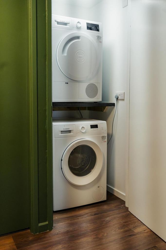 A compact and tidy kitchen area featuring a sta...