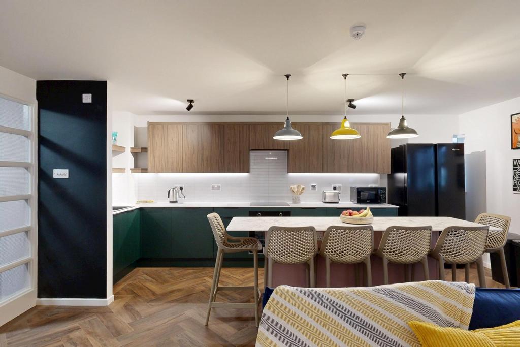 Bright, modern open-plan studio with a fitted k...