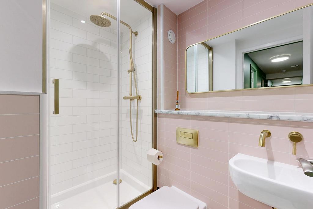 A clean and modern bathroom featuring a spaciou...