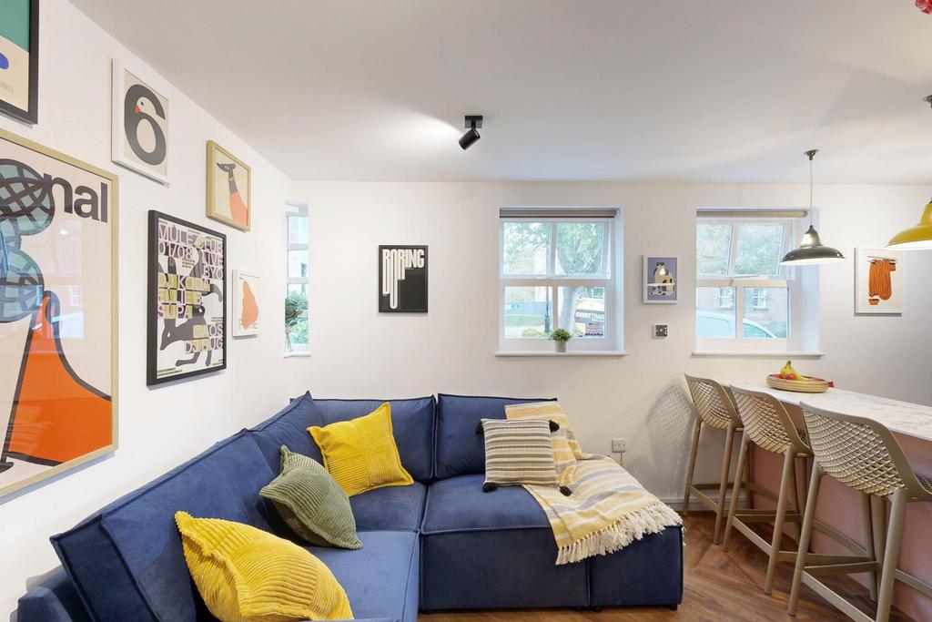 A modern and inviting living room featuring a s...
