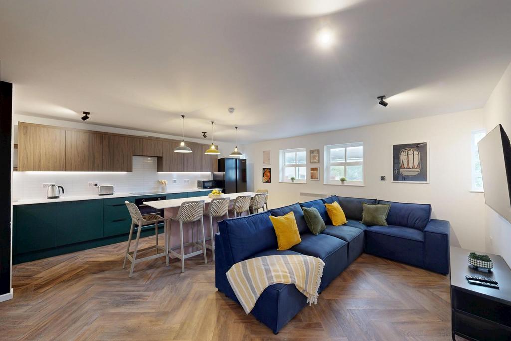 A spacious and modern living room featuring a c...