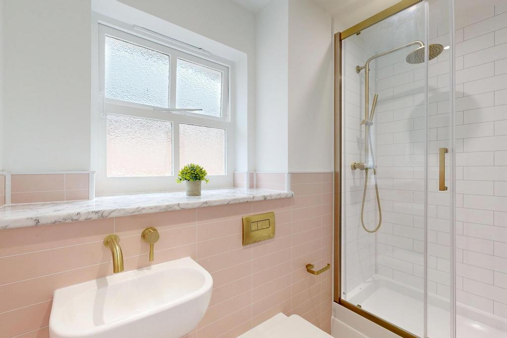 Bright and clean bathroom featuring a spacious ...