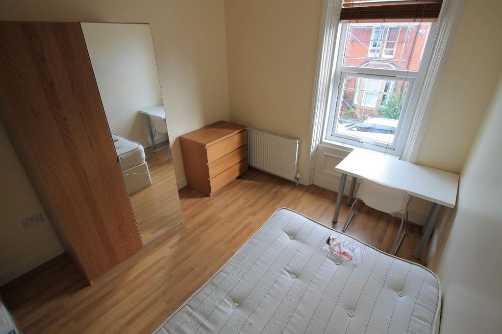 Bright and well-maintained master bedroom with ...
