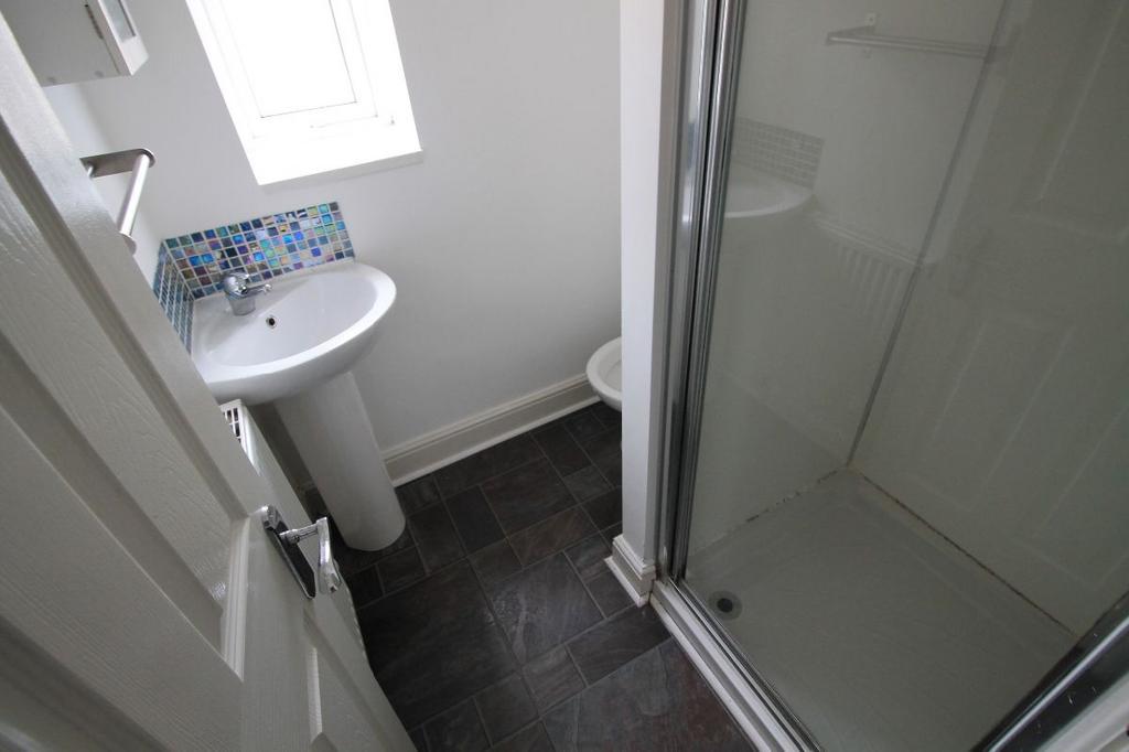 A clean, well-maintained bathroom with a modern...