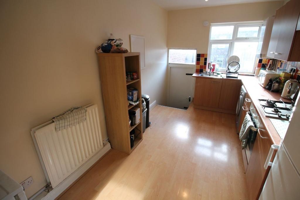 A well-lit, tidy kitchen with modern appliances...
