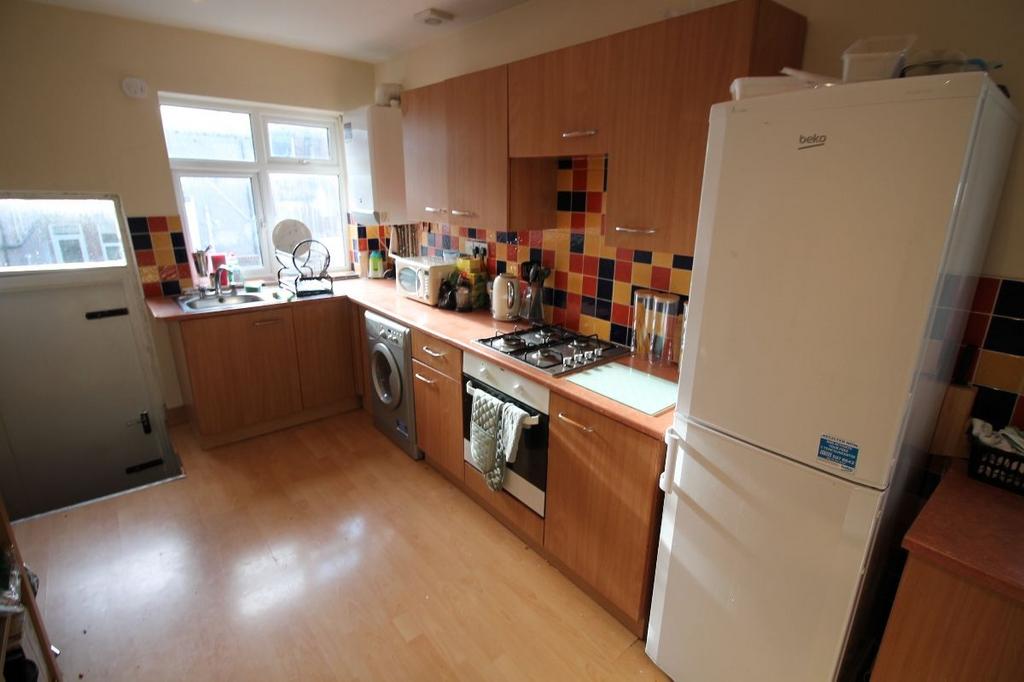 A bright and well-organized kitchen featuring m...