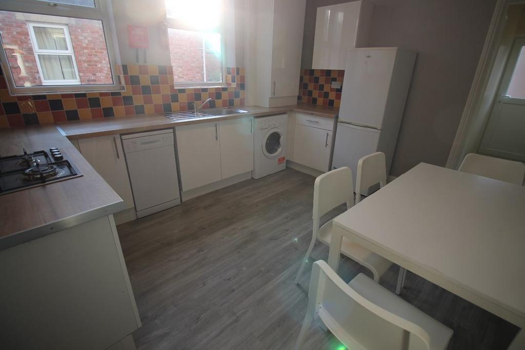 Bright and clean kitchen area featuring functio...