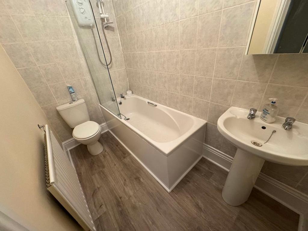 A clean and well-maintained bathroom featuring ...