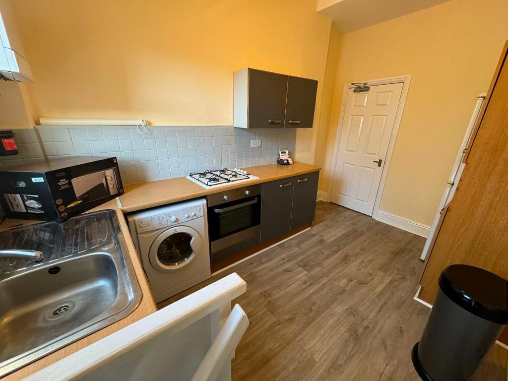 A well-maintained kitchen area featuring essent...