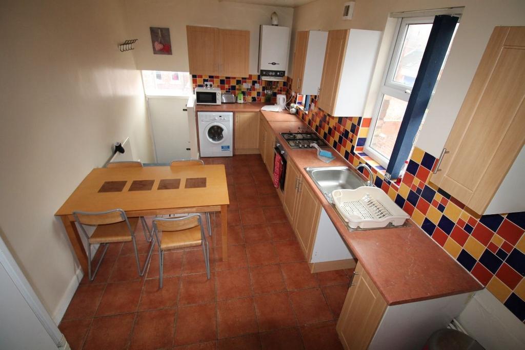 A bright and functional kitchen with ample coun...