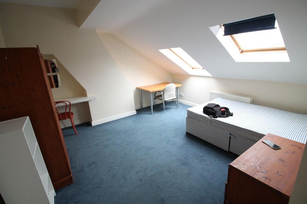 Bright and airy bedroom featuring a comfortable...