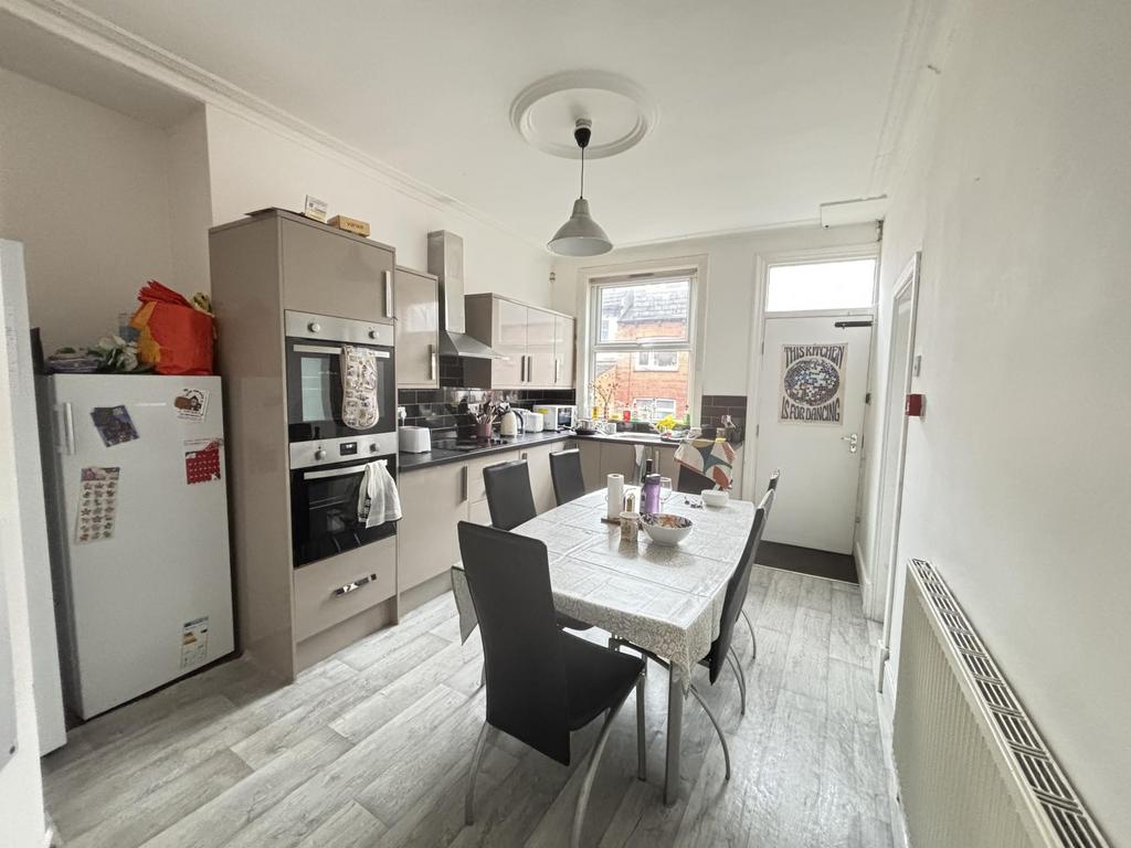 Bright, modern fitted kitchen with dining table...