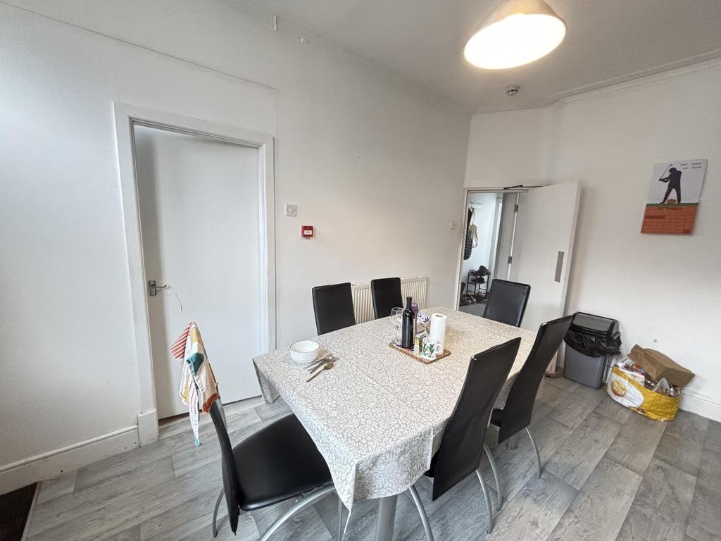 Bright, neutral communal dining or study area w...
